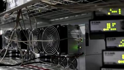 Wind turbines powering a crypto mining farm